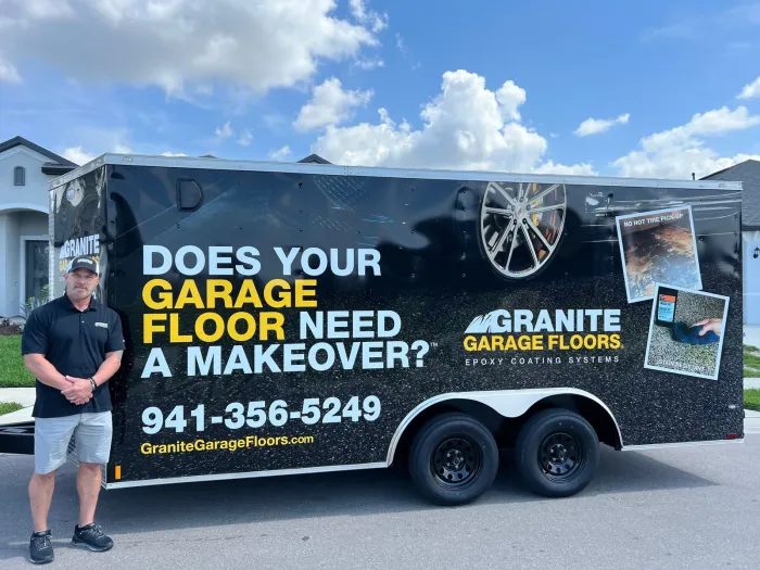 Keith Stopko standing next to a trailer