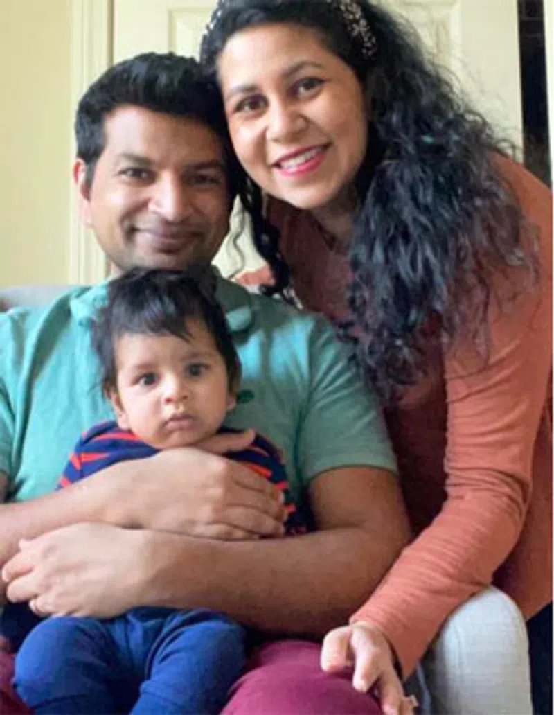 Smiling family of three