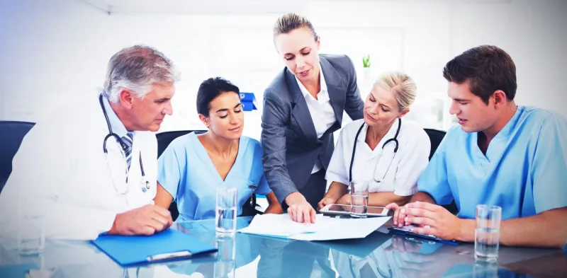 a group of people sitting at a table
