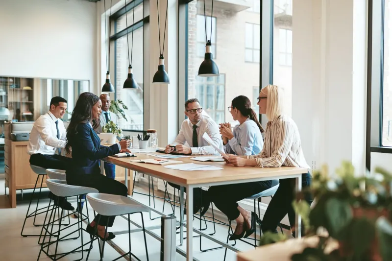 a group of people sitting at a table
