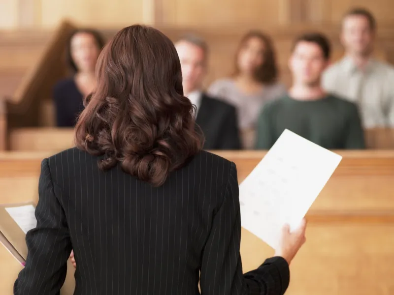a woman speaking to a group of people