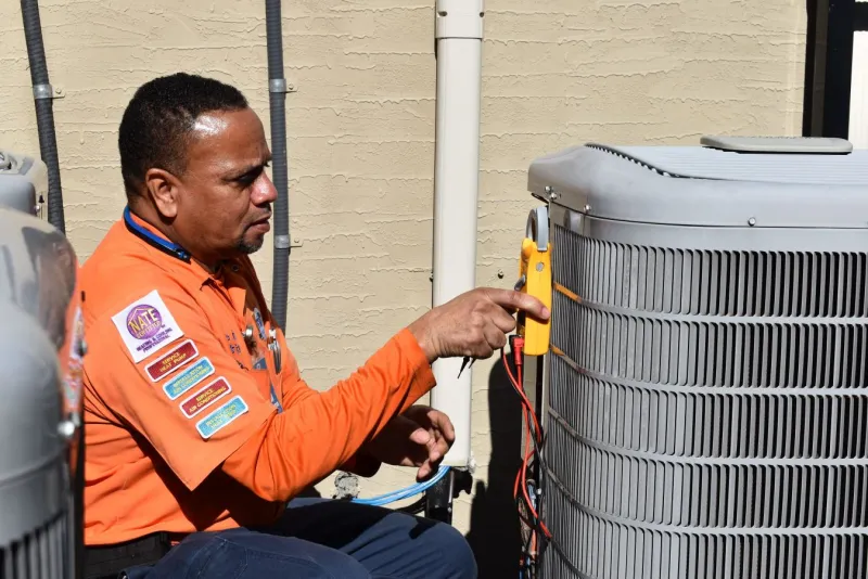HVAC Estes Technicians is fixing an AC unit