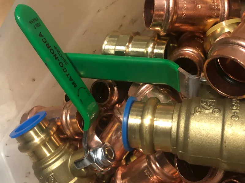 a close-up of a person fixing a pipe