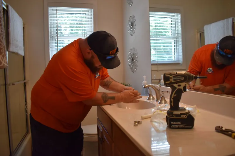 Installation of new plumbing fixtures in a guest bathroom in Duluth, Georgia