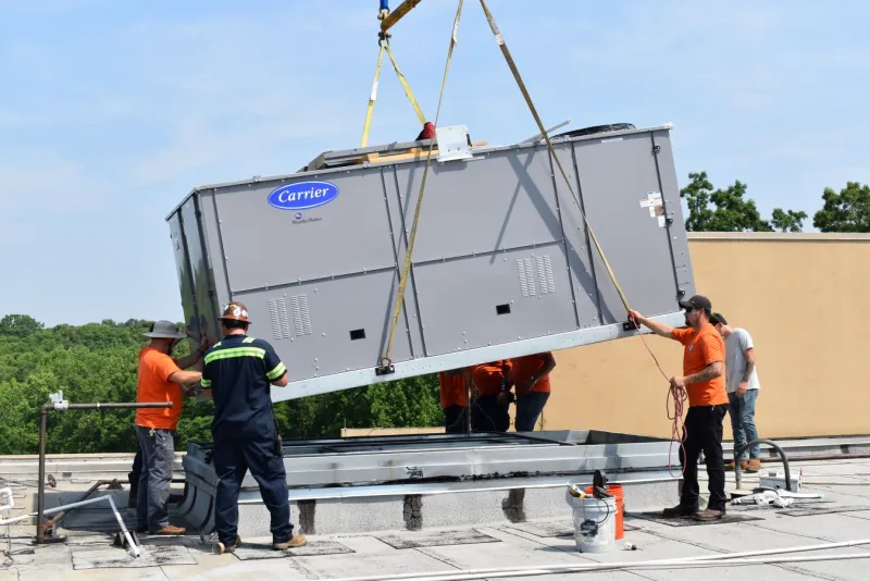 An Estes Services technician performing a commercial HVAC repair in Atlanta, GA.