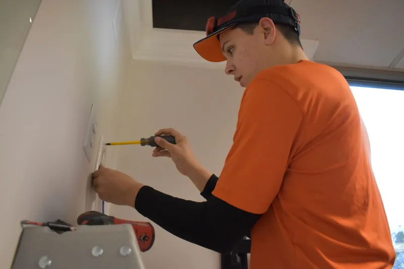 Estes electrician fixing an outlet