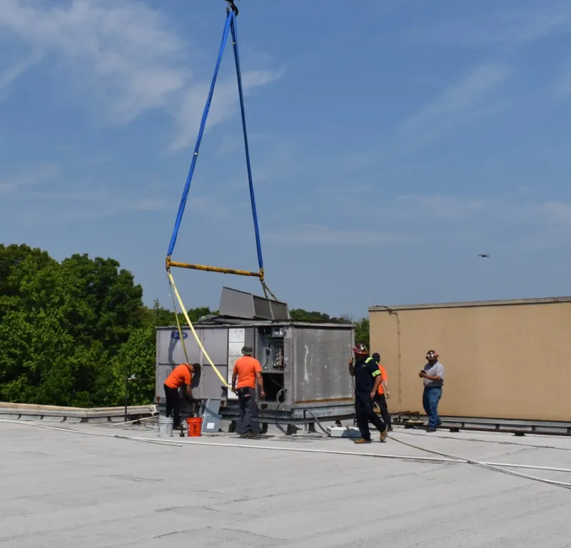 a group of people working on a large machine