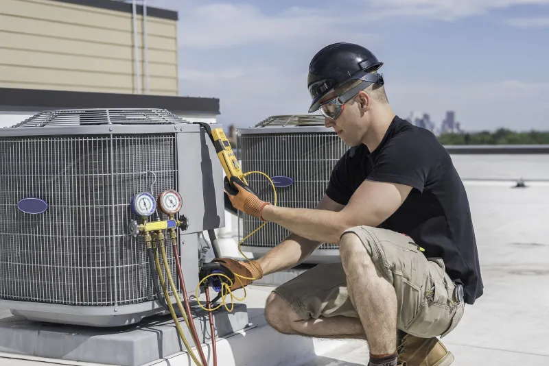 a man working on a HVAC System