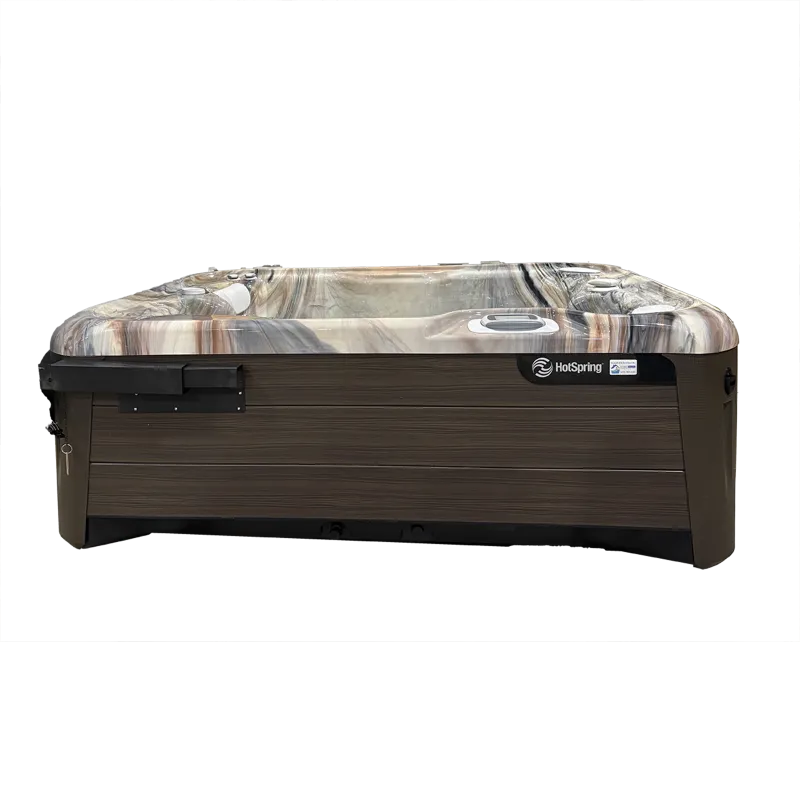 Modern HotSpring spa with marble-like interior and dark wood exterior paneling, designed for outdoor relaxation.