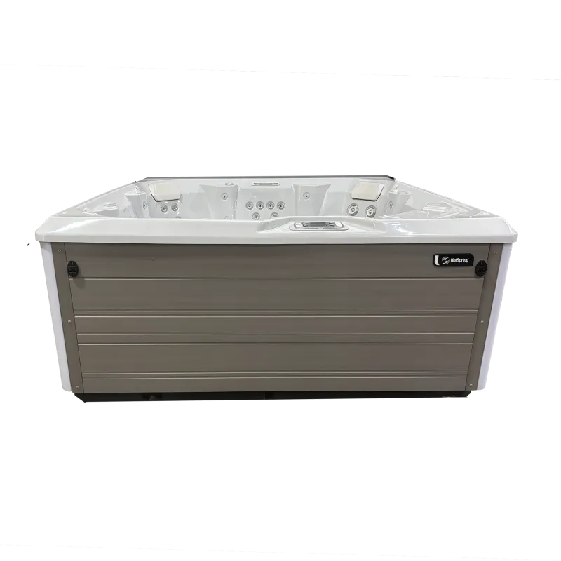 Modern rectangular hot tub with built-in jets and headrests, designed for outdoor relaxation and hydrotherapy.