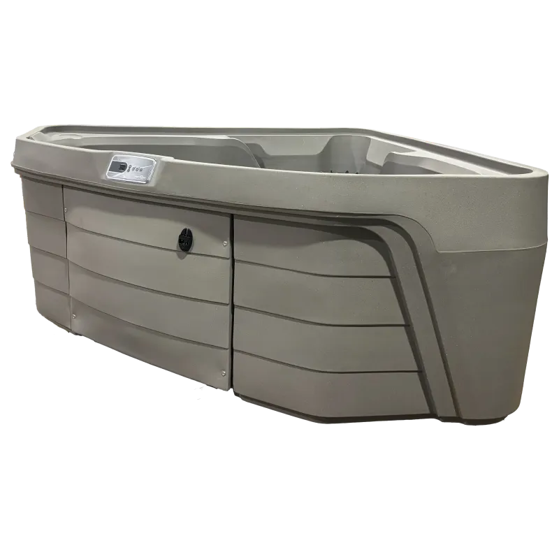 Modern gray swim spa with control panel and ergonomic seating isolated on black background