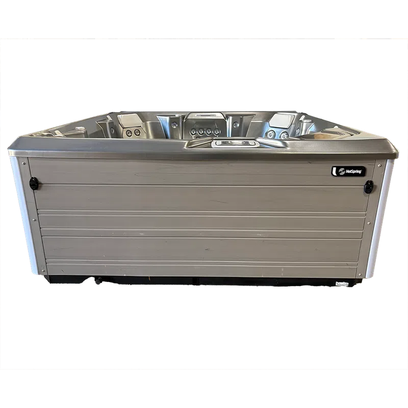 Modern rectangular hot tub with multiple jets and a control panel on a transparent background