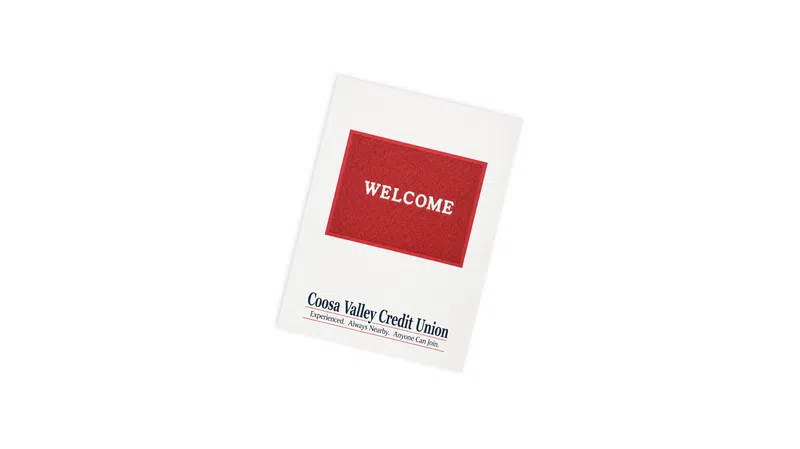 Coosa Valley Credit Union welcome card with red welcome text on white background.