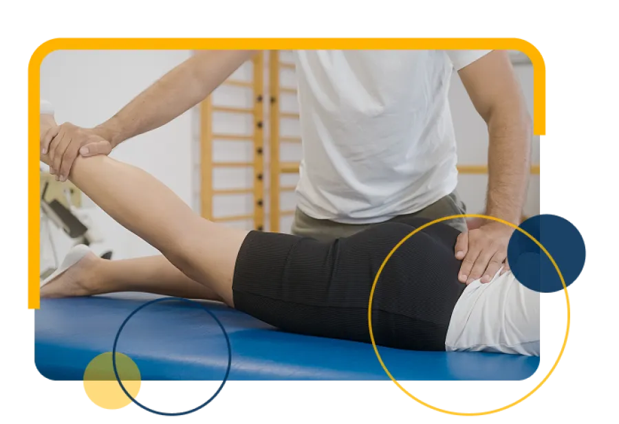 Chiropractor performing spinal adjustment on a patient lying face down on a treatment table in a clinic.