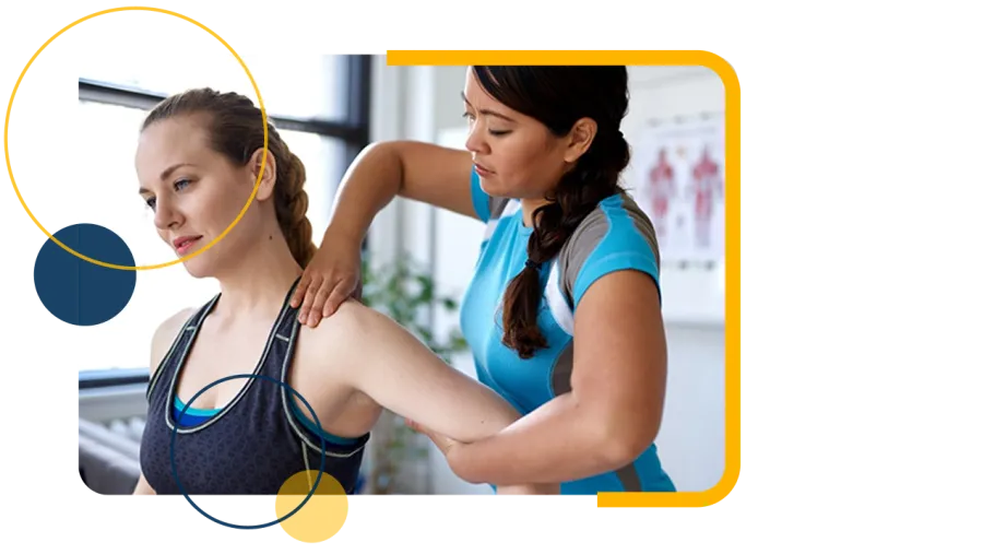Physical therapist assisting woman with shoulder stretch in a bright therapy room.