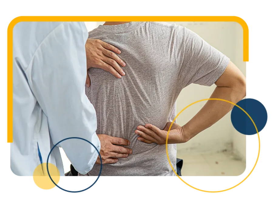Doctor examining patient's lower back pain in a clinical setting, highlighting medical care and treatment.