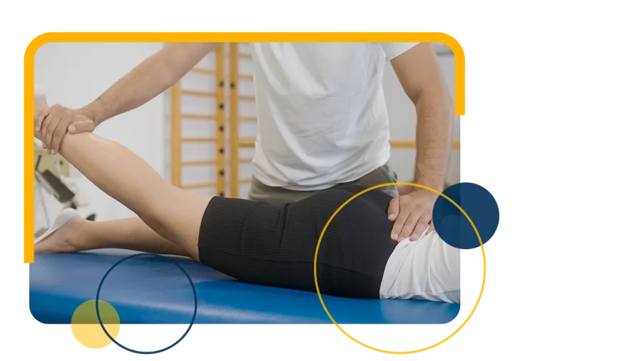 Chiropractor performs spinal adjustment on patient lying face down on treatment table in clinic.