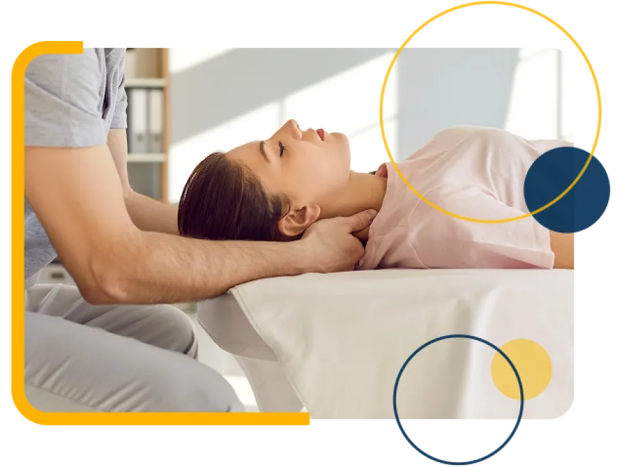 Chiropractor performing neck adjustment on a woman lying on a treatment table in a bright clinic.