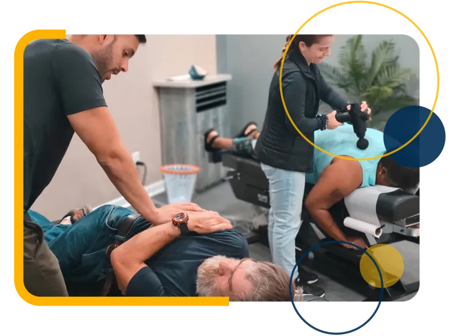 Trainer assisting woman in gray sports bra with arm stretch during fitness session indoors.