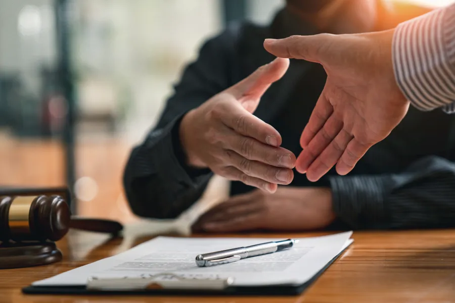 a close-up of people shaking hands