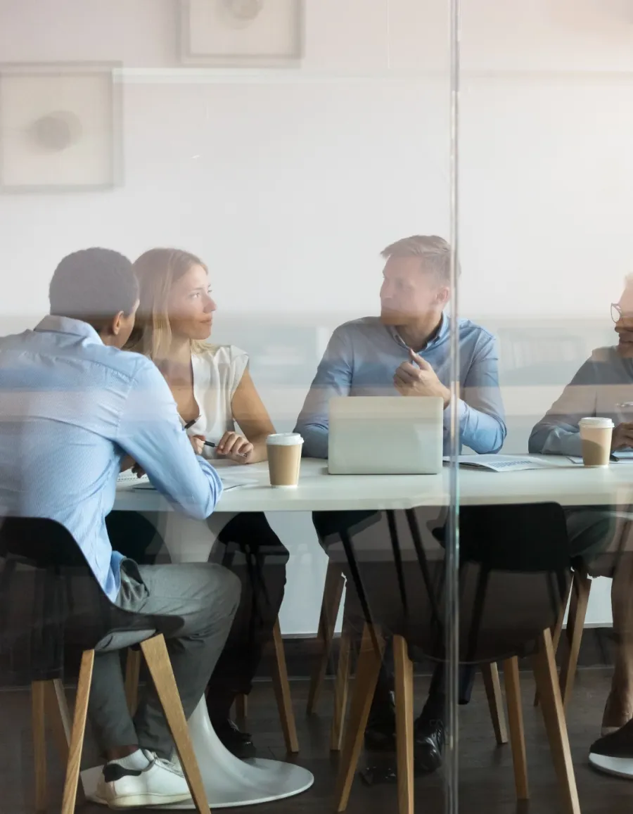 a group of people sitting around a table