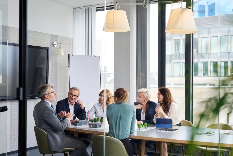 a group of people sitting around a table