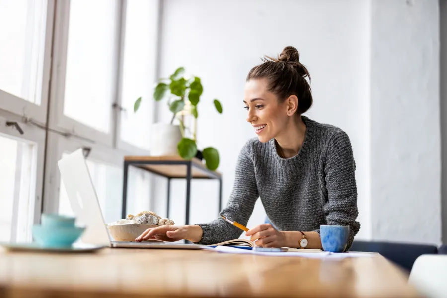 a woman working on her laptop