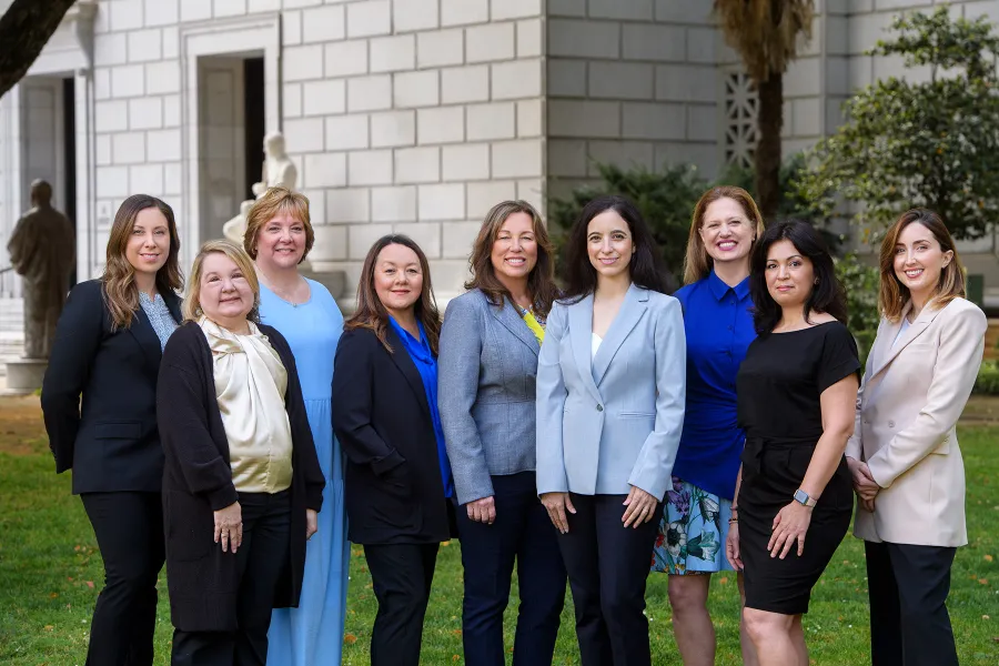 a group of women posing for a photo