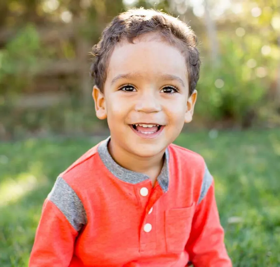 a boy smiling for the camera