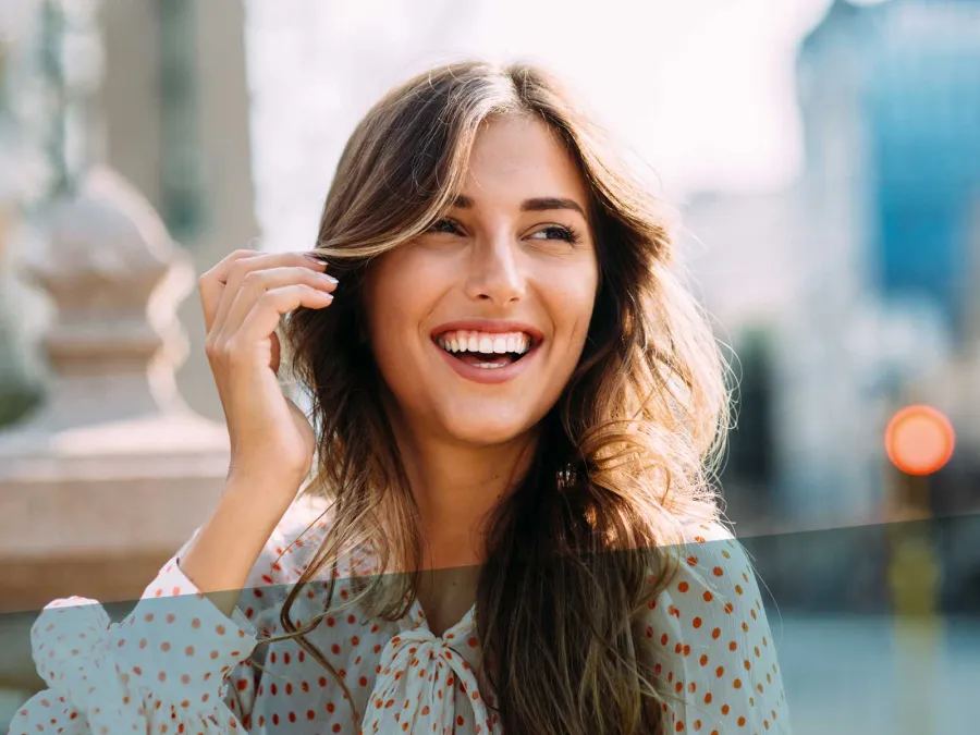 Kristina and Karissa Shannon smiling with her hand on her head