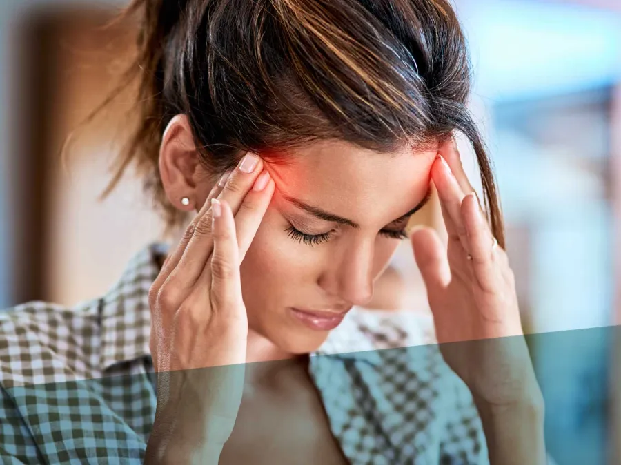 a person with the hands on the face