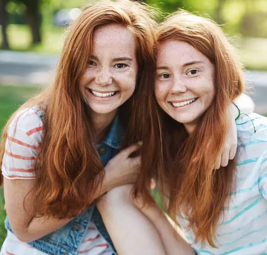 a couple of women embracing