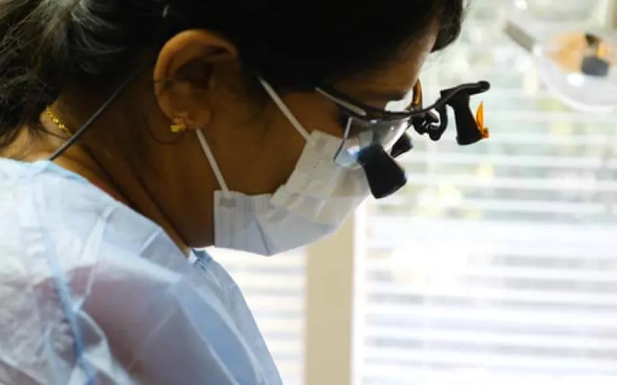 a person wearing a mask and eyeglasses