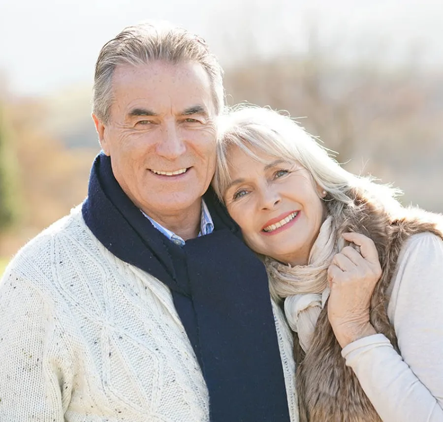a man and woman smiling