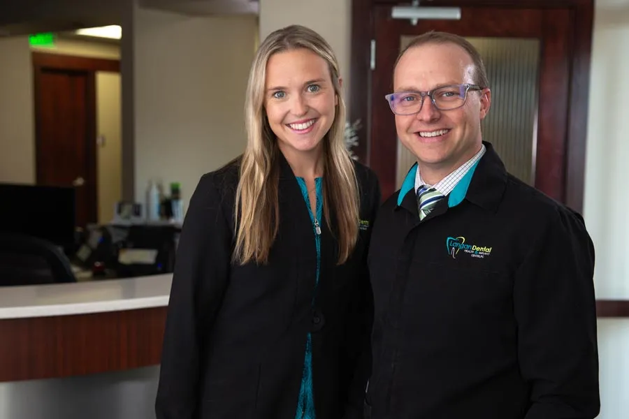 a man and a woman smiling