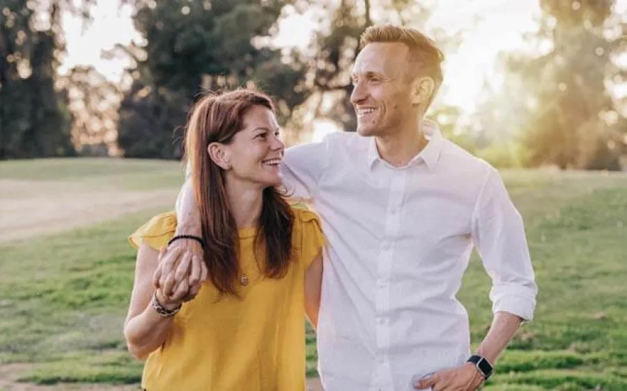 a man and woman smiling