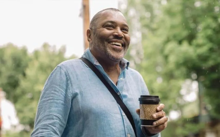 a man holding a coffee cup