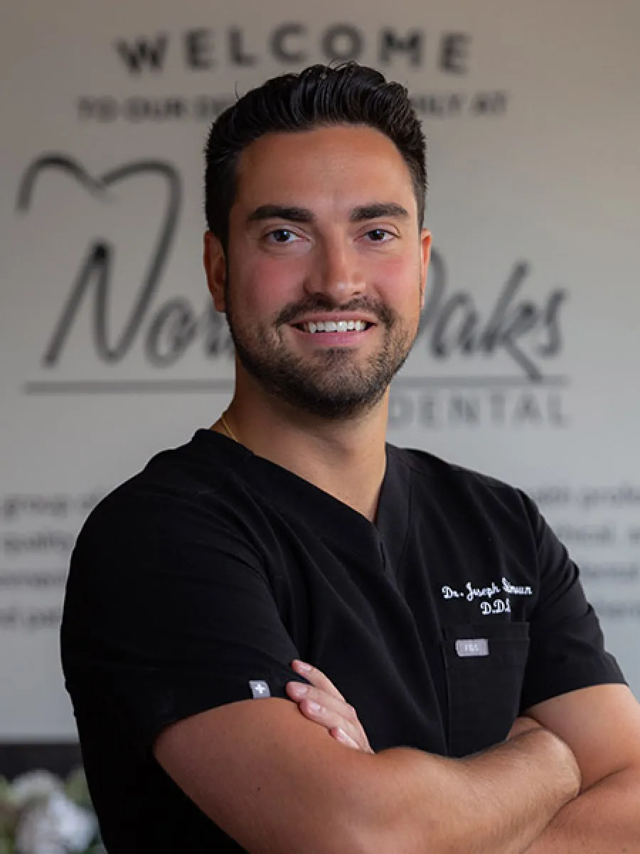 Logo for The Implant Center at North Oaks Dental featuring bold lettering on a dark background.