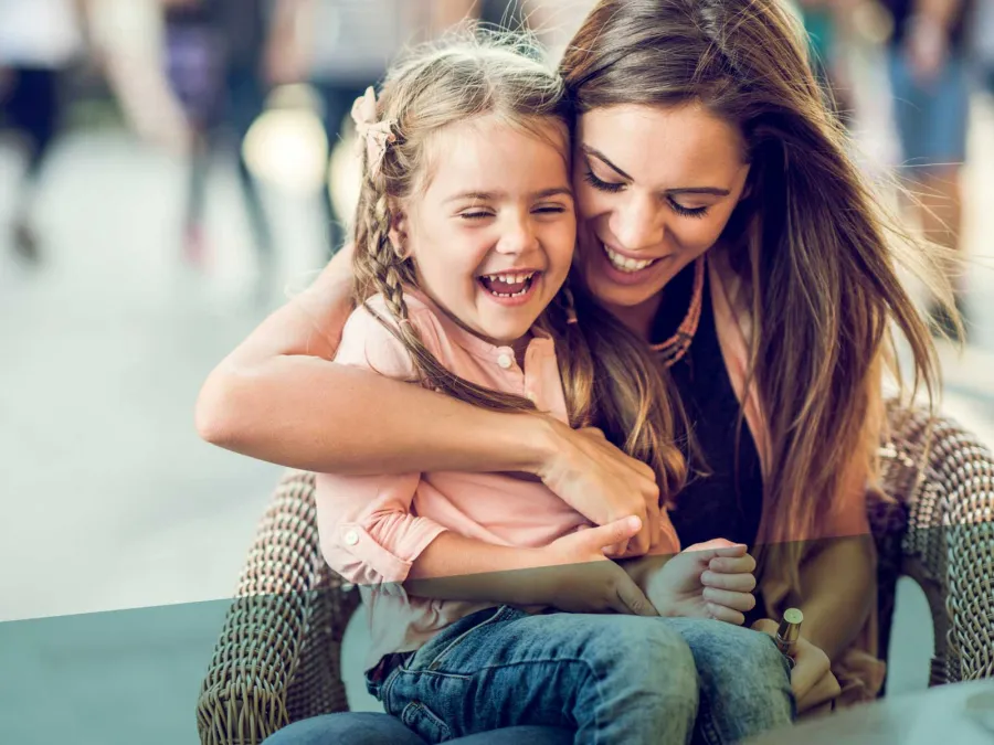 a woman holding a child