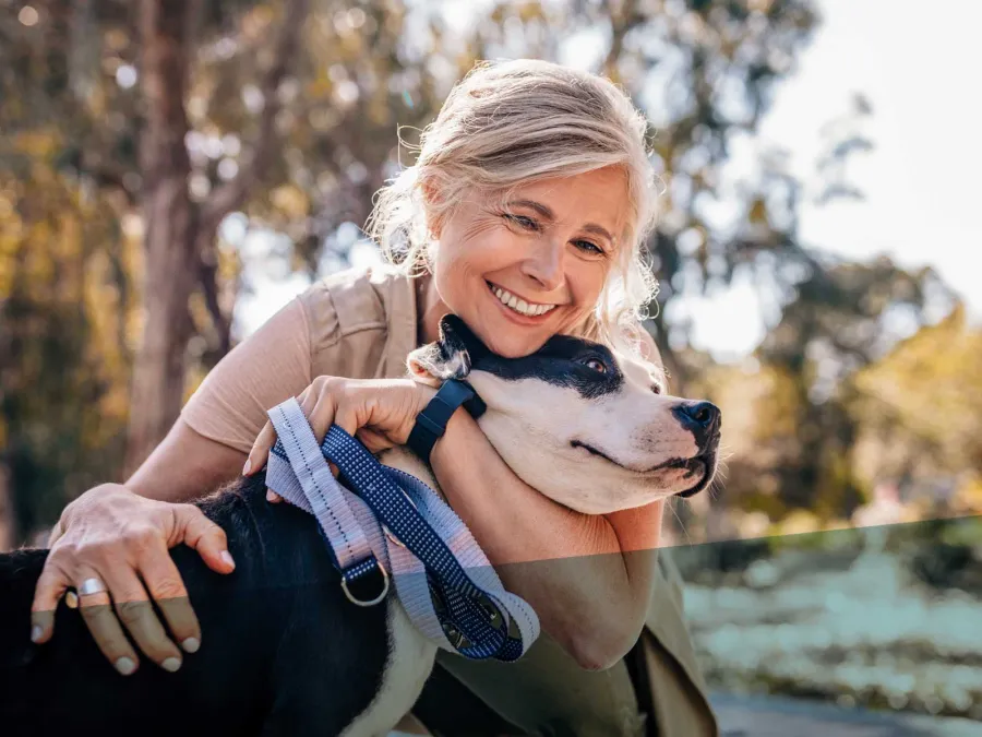 a person holding a dog