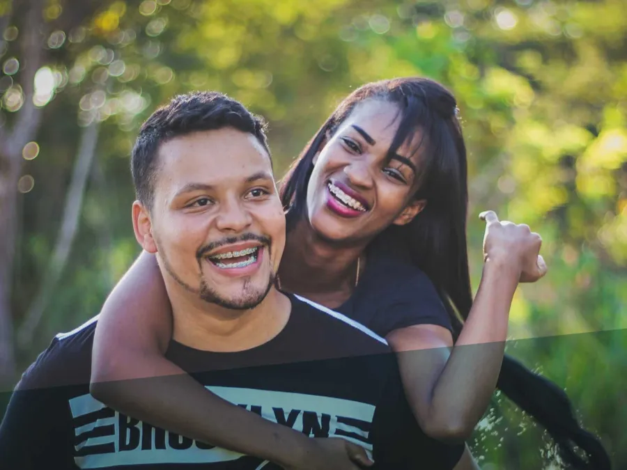 a man and woman smiling