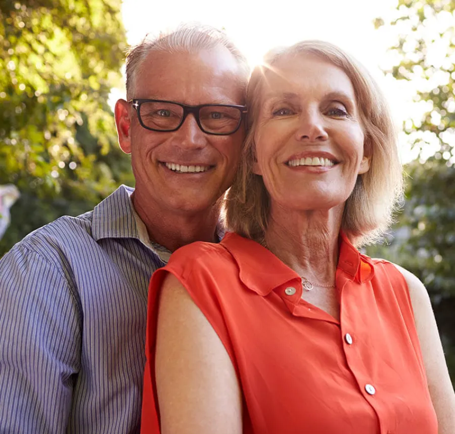 a man and woman smiling