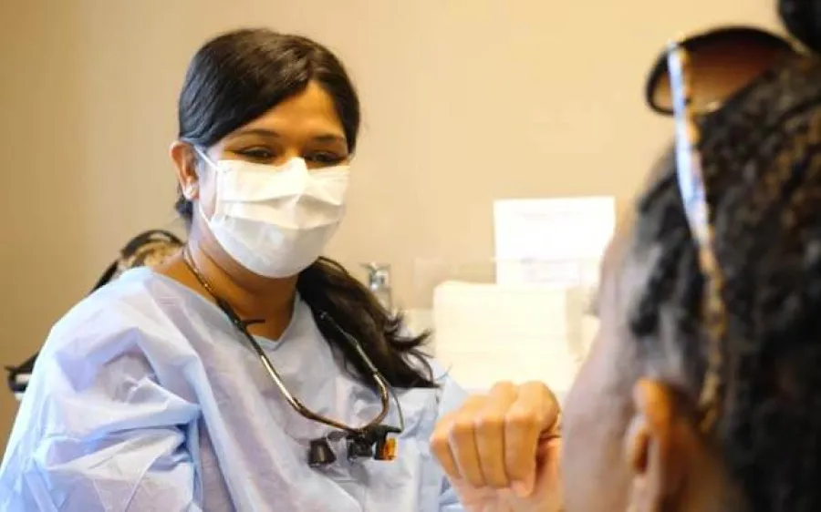 a doctor looking at a patient