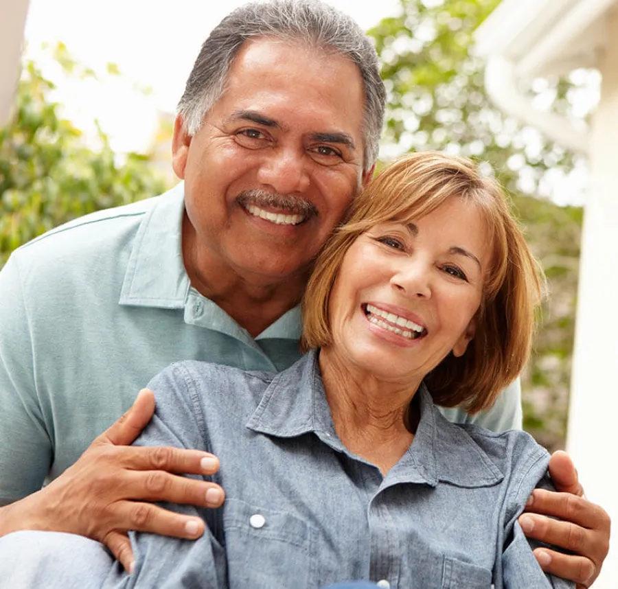 a man and a woman smiling