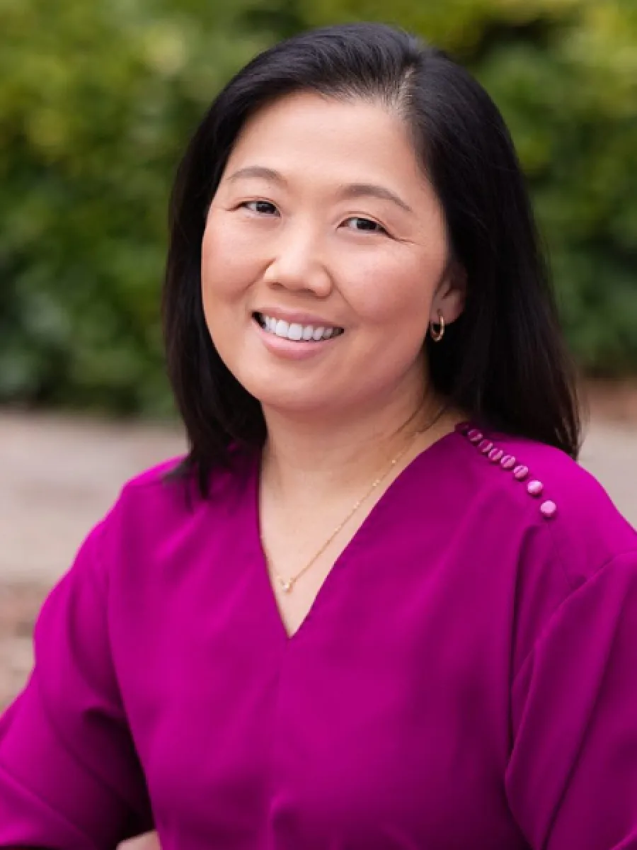 a woman smiling for the camera