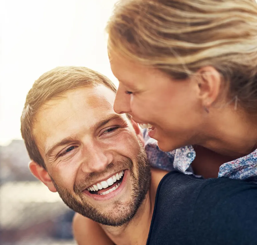 a man and a woman smiling