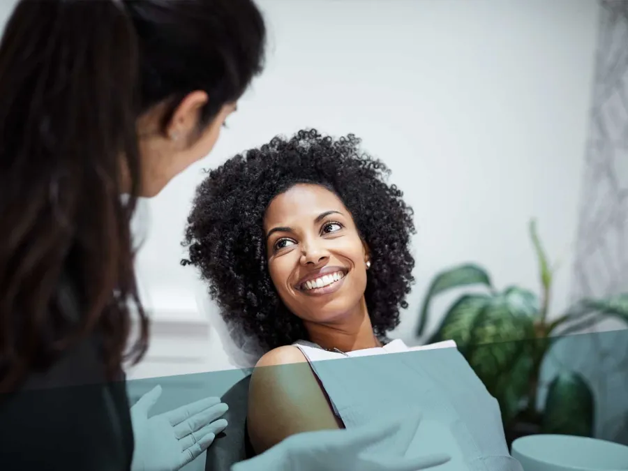 a woman smiling at another woman