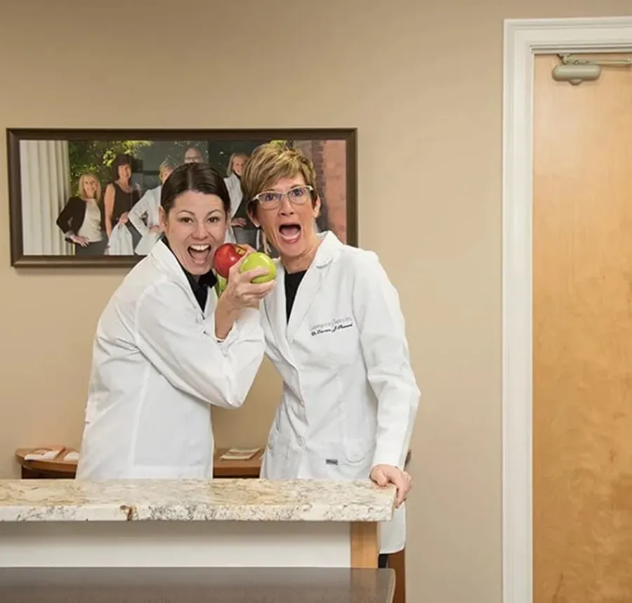 a couple of women in white coats