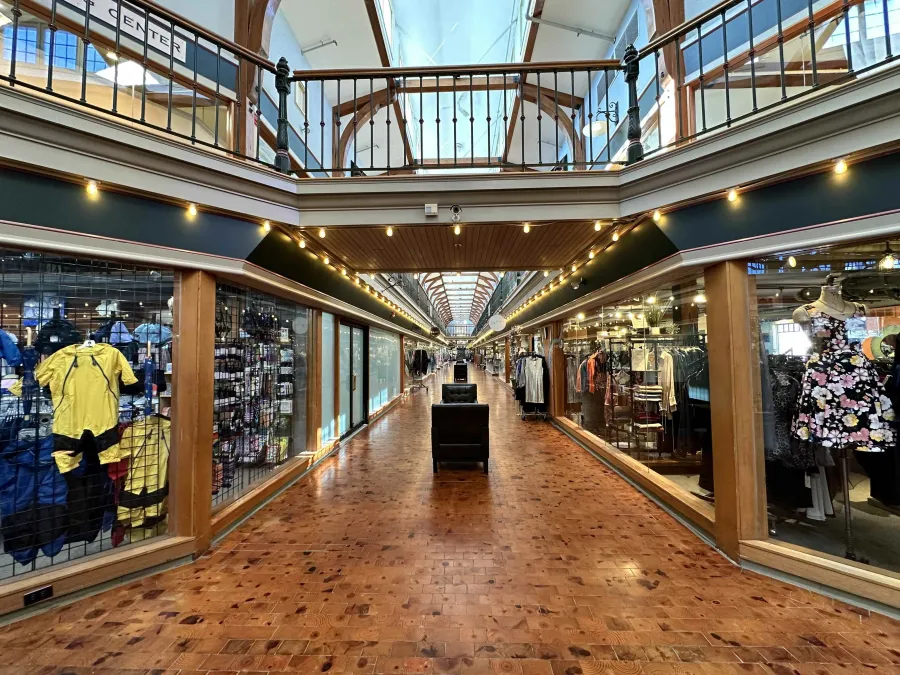 a large building with many windows and a walkway