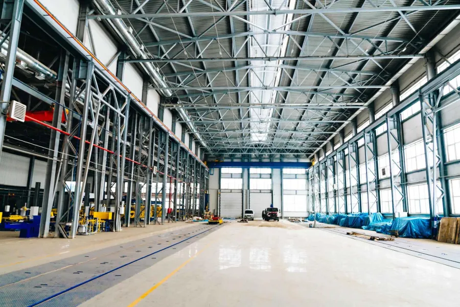 a large warehouse with many metal beams